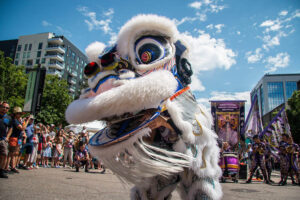 Photo of Lion Dance performance with a crowd watching