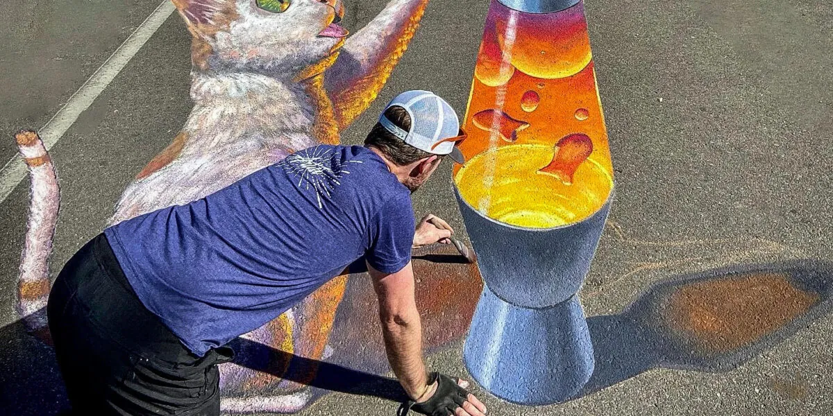 chalk drawing of a cat and a lava lap on pavement