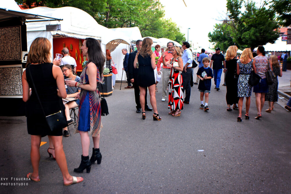crowd with artist booths at Opening Night