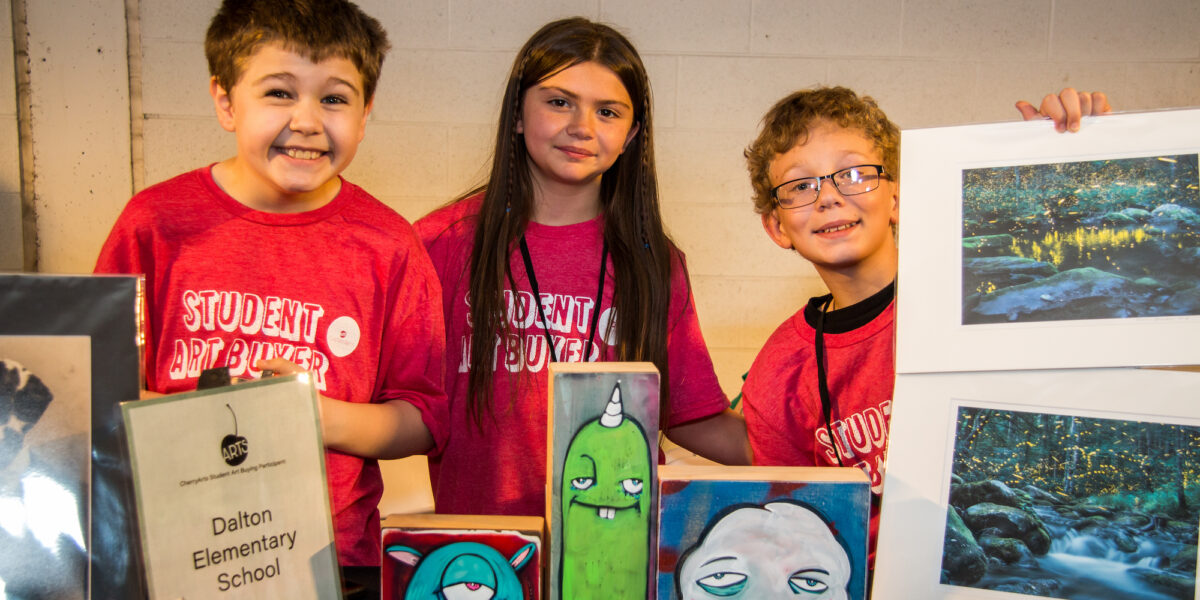 students with purchased artwork displayed