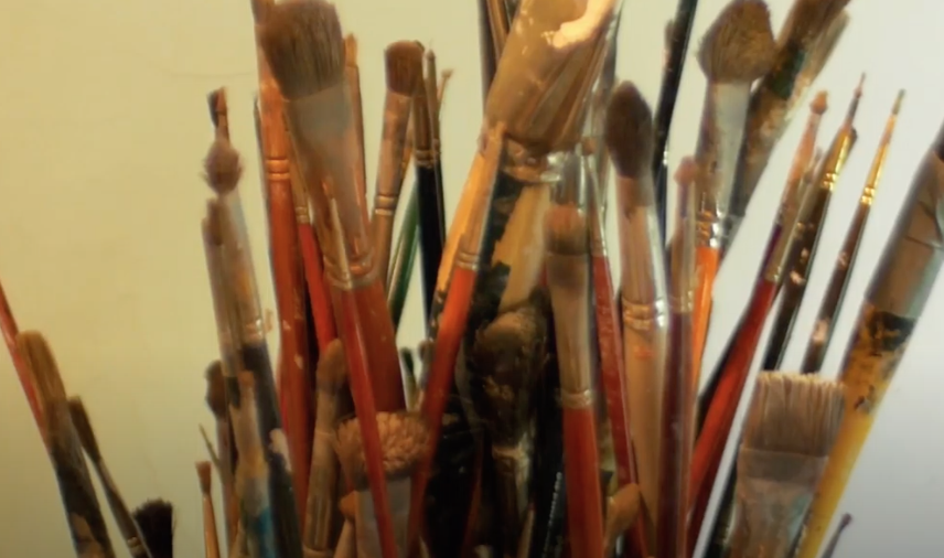 paint brushes in cup