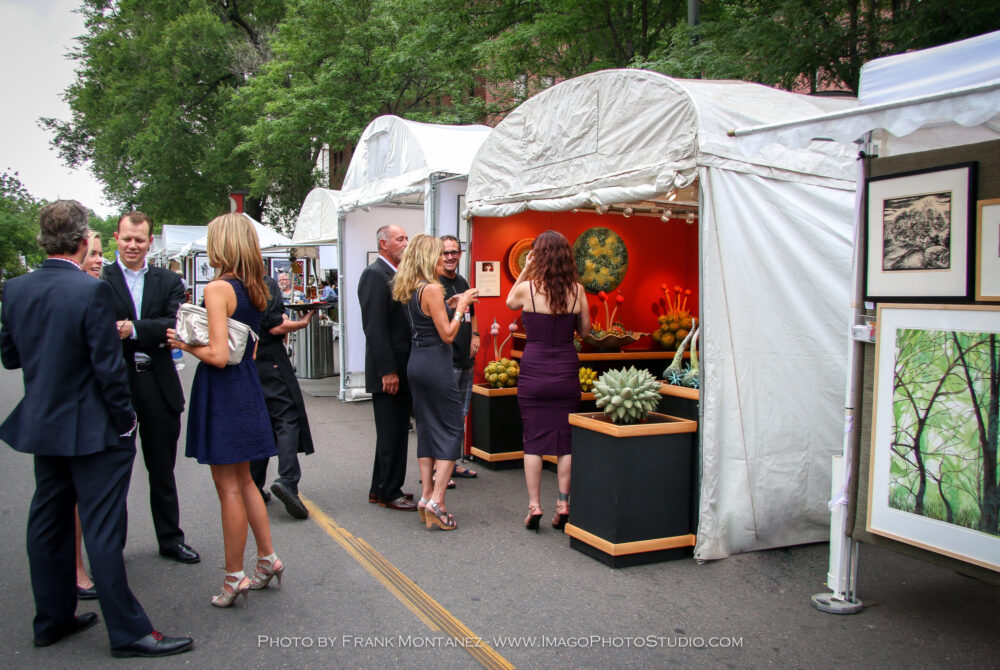 Photo of crowd mingling around artist booths. Photo by Frank Montanez